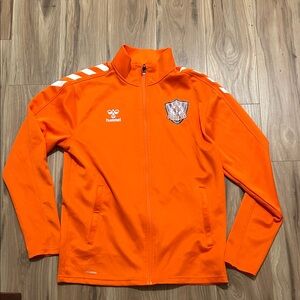 Orange zippered athletic jacket with zippered pockets